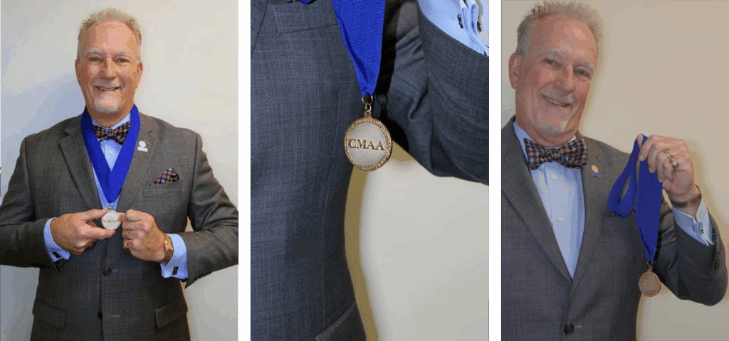 Kerins wearing his Fellowship medal